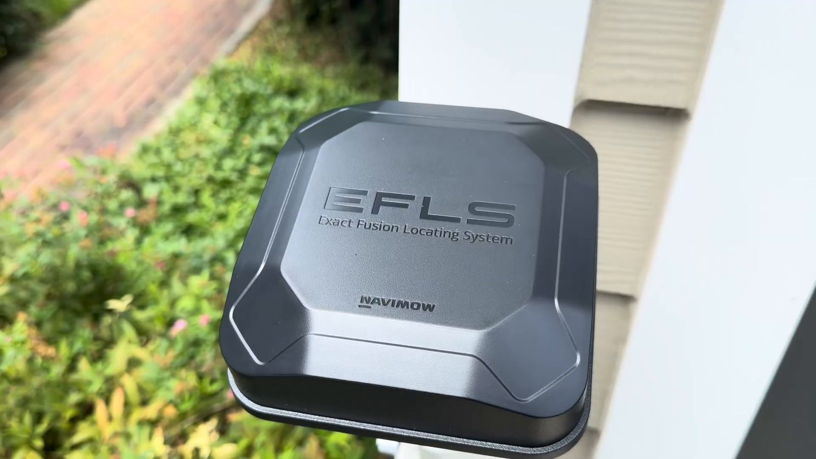 Close-up of the Navimow EFLS Exact Fusion Locating System antenna on its wall mount
