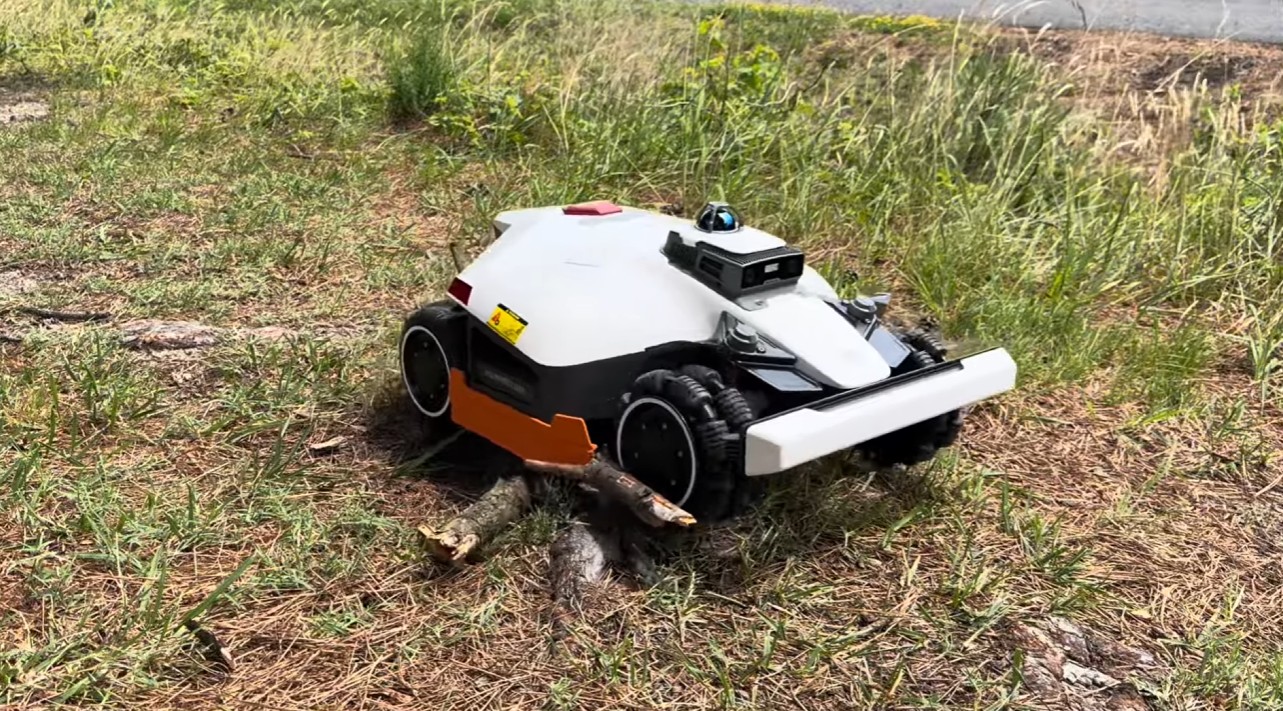 A Mammotion LUBA 3 using its 360-degree LiDAR to cross rough, uneven ground
