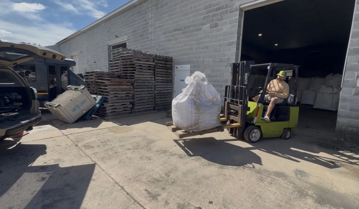 A bulk bag of Organic Lawn Builder compost on a forklift outside the MYCOguard facility in Kennett Square, PA