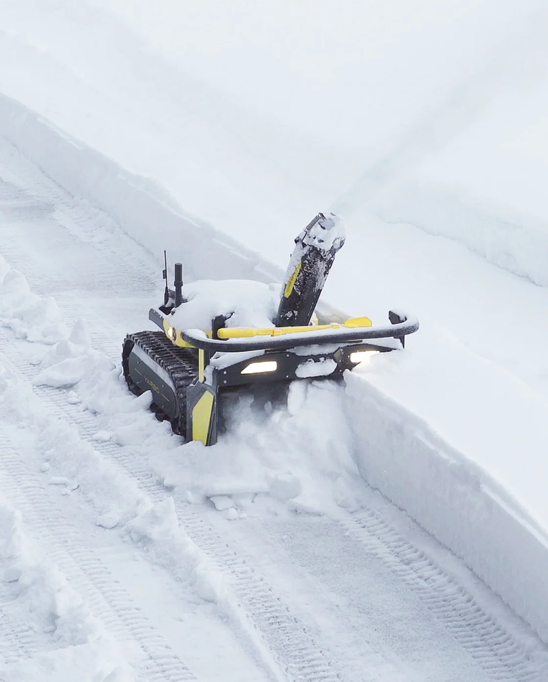 The Yarbo Snow Blower buried in a deep cut and still working